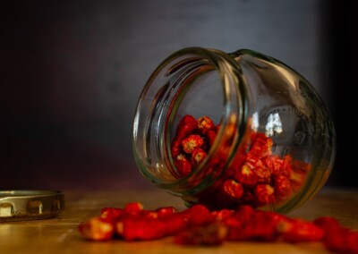 Dried Chillies in a glass jar still life, dried chillies, glass jar, food photography, still life photo of dried chillies, still life photography, red chilli spice