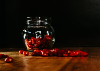 Dried Chillies in a glass jar still life, dried chillies, glass jar, food photography, still life photo of dried chillies, still life photography, red chilli spice