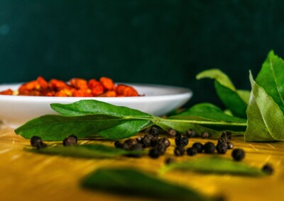 Dried Chillies still life, dried chillies, food photography, still life photo of dried chillies, still life photography, red chilli spice, bay leaves, whole black peppercorns