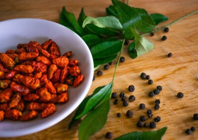 Dried Chillies still life, dried chillies, food photography, still life photo of dried chillies, still life photography, red chilli spice, bay leaves, whole black peppercorns