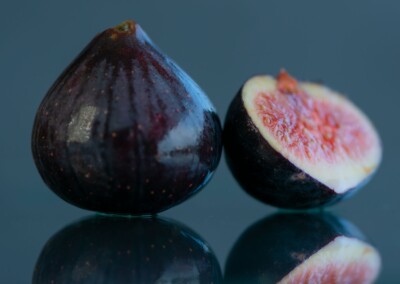 cut open figs still life with reflections