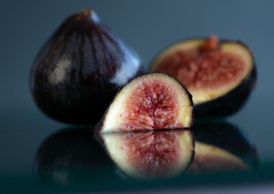 cut open figs still life with reflections