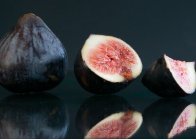 cut open figs still life with reflections